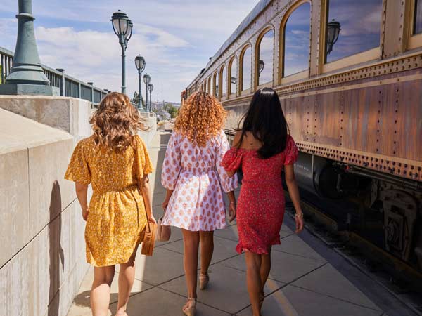 Girls Walking Next To The Wine Train.