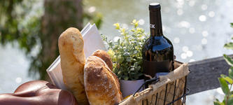 Wine And Bread In A Bicycle Basket.