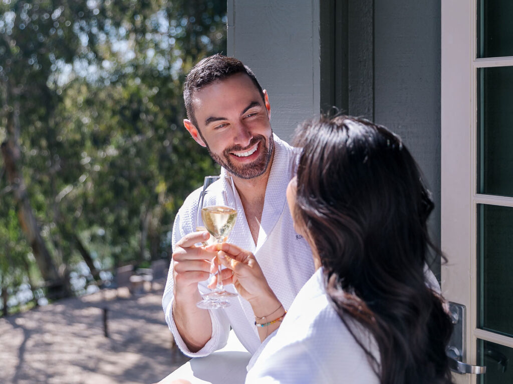 Couple Drinking Wine On The Balcony